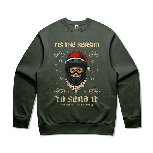 Green sweatshirt with a graphic of  Santa  wearing a helmet and santa hat and text saying tis the season to send it